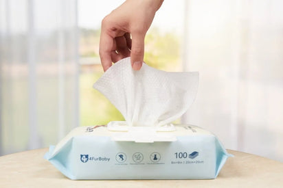 Hand pulling a wet wipe from a FurBaby branded wet wipes pack.