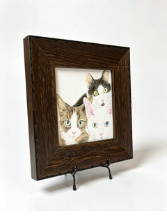 Rustic dark wood memorial picture frame displaying a portrait of three cats on a black metal tabletop stand