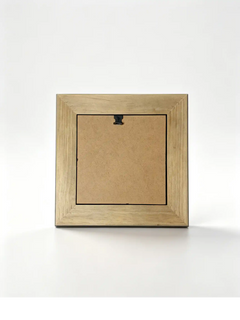 Rear view of a natural wood picture frame with a removable backing panel and wall-hanging hardware