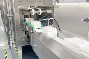 Automated packaging machine in a factory setting
