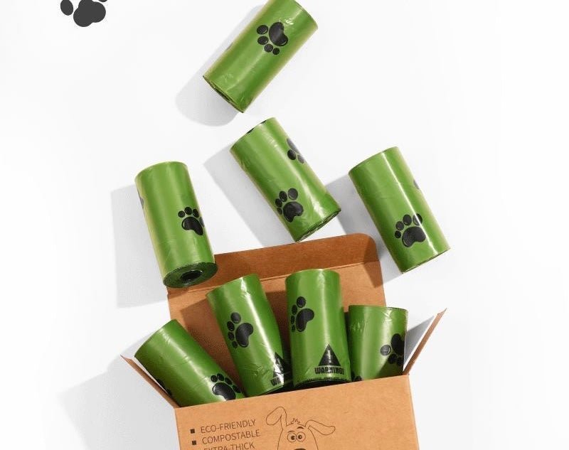 biodegradable trash pet poop bags along with a dispenser designed for convenience and environmental sustainability